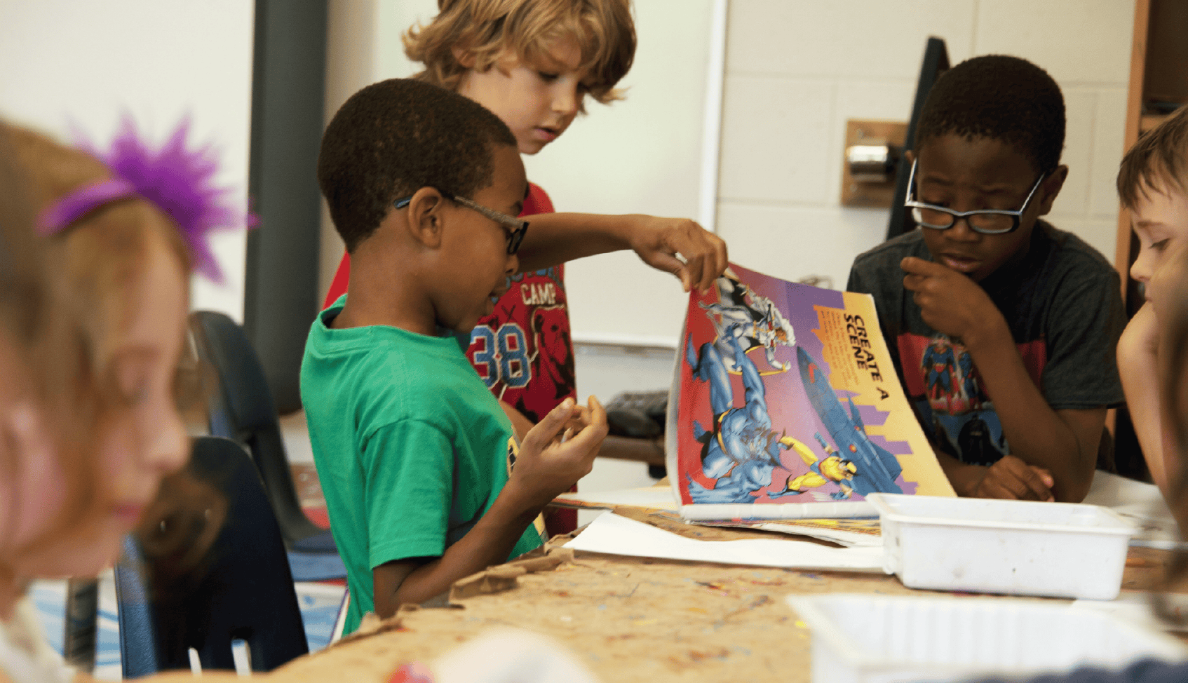 Children engaging in creative activities at Tots +Co, Wellington Presbyterian Church.